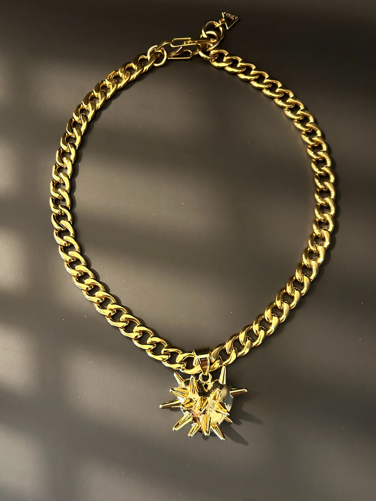 DIPHDA Slayed Heart Necklace with spike heart pendant on flat curb chain, available in gold or stainless steel—bold unisex statement jewelry handcrafted in LA.