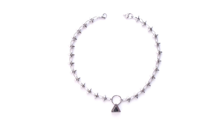 One of a kind stainless steel spike choker necklace centered with an O-ring and crystal triangle pendant. Elegant and edgy handmade jewelry. Custom rock spike chain.