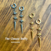 The DIPHDA Classic Buffy Spike Earrings - Two pairs, Silver & gold in Medium (the Classic) size. Cuff Earrings with two spikes hanging, oval clips connecting them with a long spike dangling at the bottom.  Rock, punk, chic spike earrings. Single earrings & double earrings. Sold in silver (stainless steel) & gold.