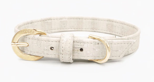 Shop our vegan leather white cork pet collar, a cruelty-free and sustainable pet accessory for your beloved pet. Made from eco-friendly materials, this dog and cat collar combines style and ethics, perfect for conscious pet owners. Cruelty-free, luxury dog collar, unique pet collar, boho chic pet accessories, premium collars, organic look, ethically made, handmade in the USA, LGBTQIA woman-owned, for the fashion dog. 