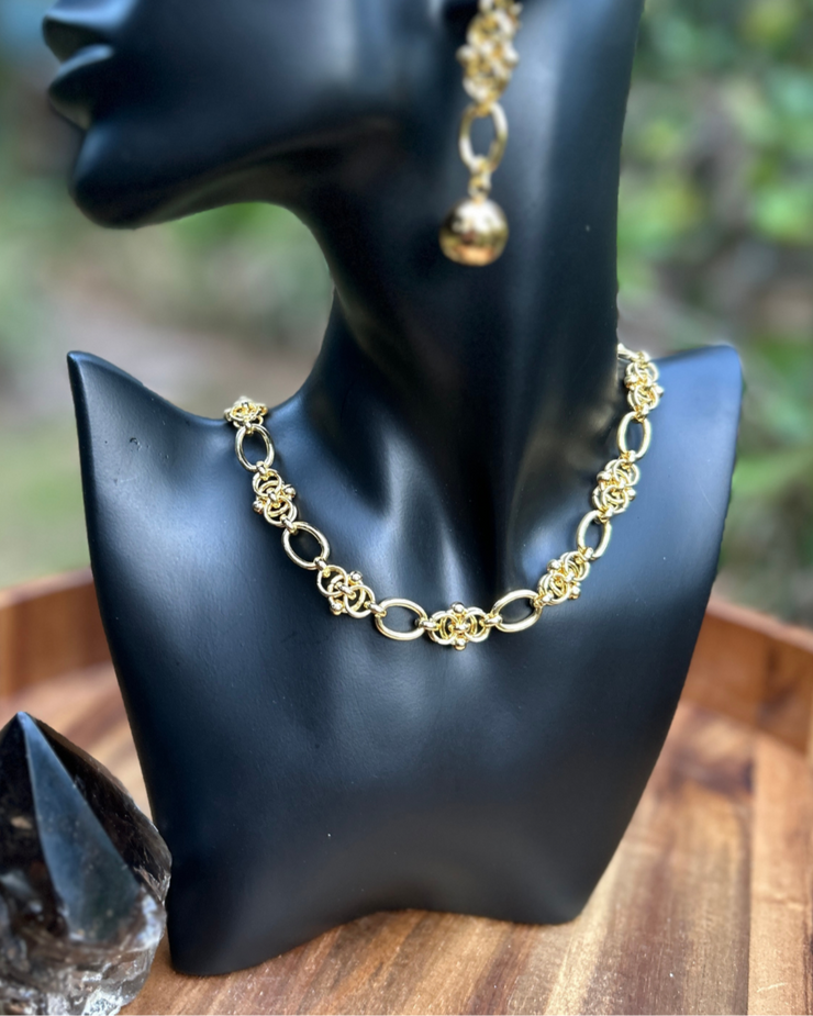 DIPHDA Eclipse Necklace in Gold on black jewelry bust - unique interwoven ball chain that looks expensive yet edgy.
