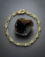 DIPHDA Eclipse Necklace in Gold - handmade unique interwoven ball chain that looks expensive yet edgy.