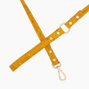 Shop our vegan leather yellow cork pet leash, a cruelty-free and sustainable pet accessory for your beloved pet. Made from eco-friendly materials, this dog and cat leash combines style and ethics, perfect for conscious pet owners. Cruelty-free, luxury dog leash, unique pet leash, boho chic pet accessories, premium leashes, organic look, ethically made, handmade in the USA, LGBTQIA woman-owned, for the fashion dog. #color_gold-color