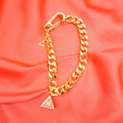 DIPHDA Jewelry - Pictured: 18K gold plated stainless steel, triangle geometric pendant/ charm bracelet, Cuban/ curb chunk chain with a large industrial clip/ clasp.  Handmade unique luxury crystal jewelry. DIPHDA jewelry is gender-neutral, for men and women. DIPHDA is a sustainable, LGBTQIA+, women-owned business. Handcrafted in Los Angeles, Made in the U.S.A. #stone_rose-quartz