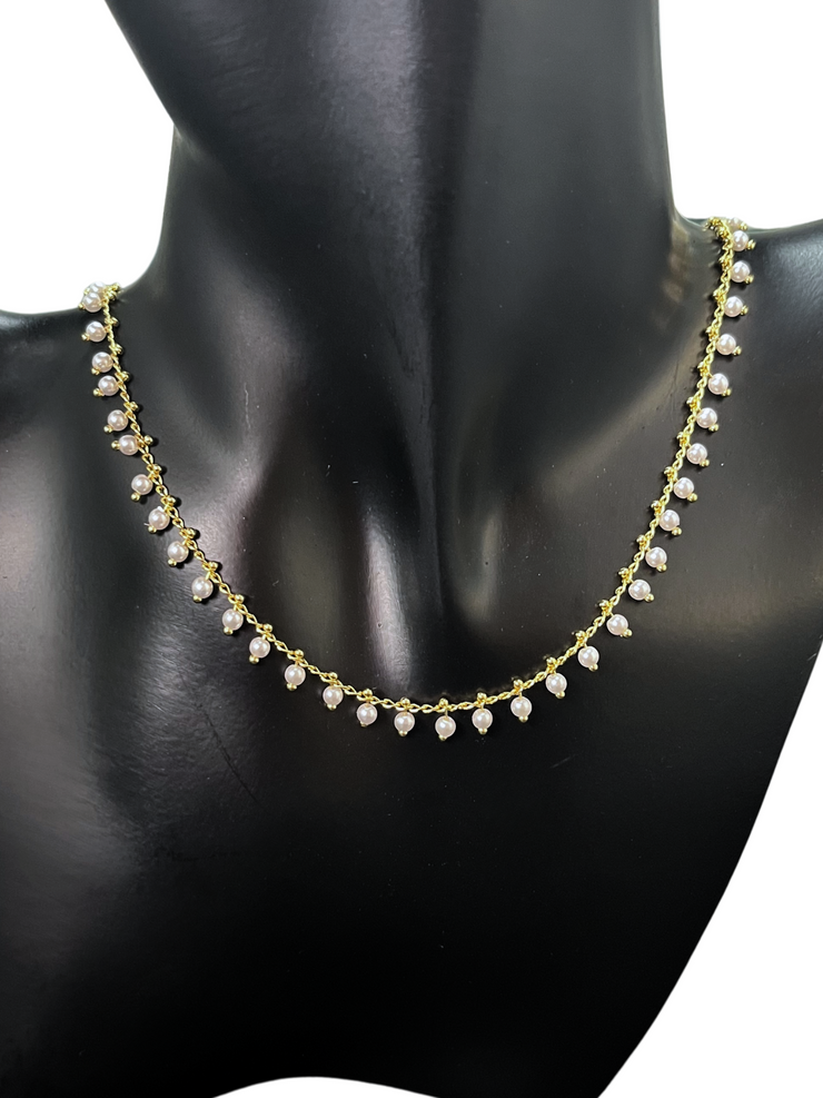 DIPHDA Mini Marie Necklace with delicate pearls on a dainty chain—layered at the collarbone for a soft, feminine, and elegant look. Handmade in Los Angeles.