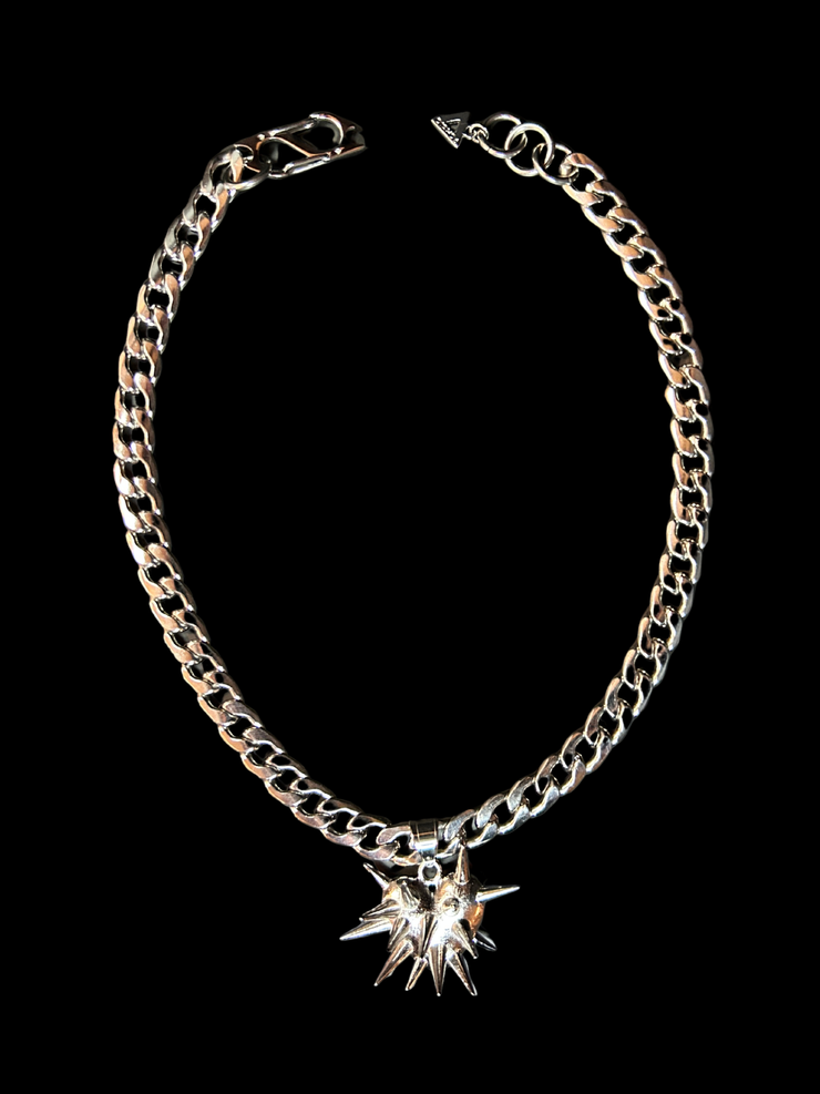 DIPHDA Slayed Heart Necklace with spike heart pendant on flat curb chain, available in gold or stainless steel—bold unisex statement jewelry handcrafted in LA.