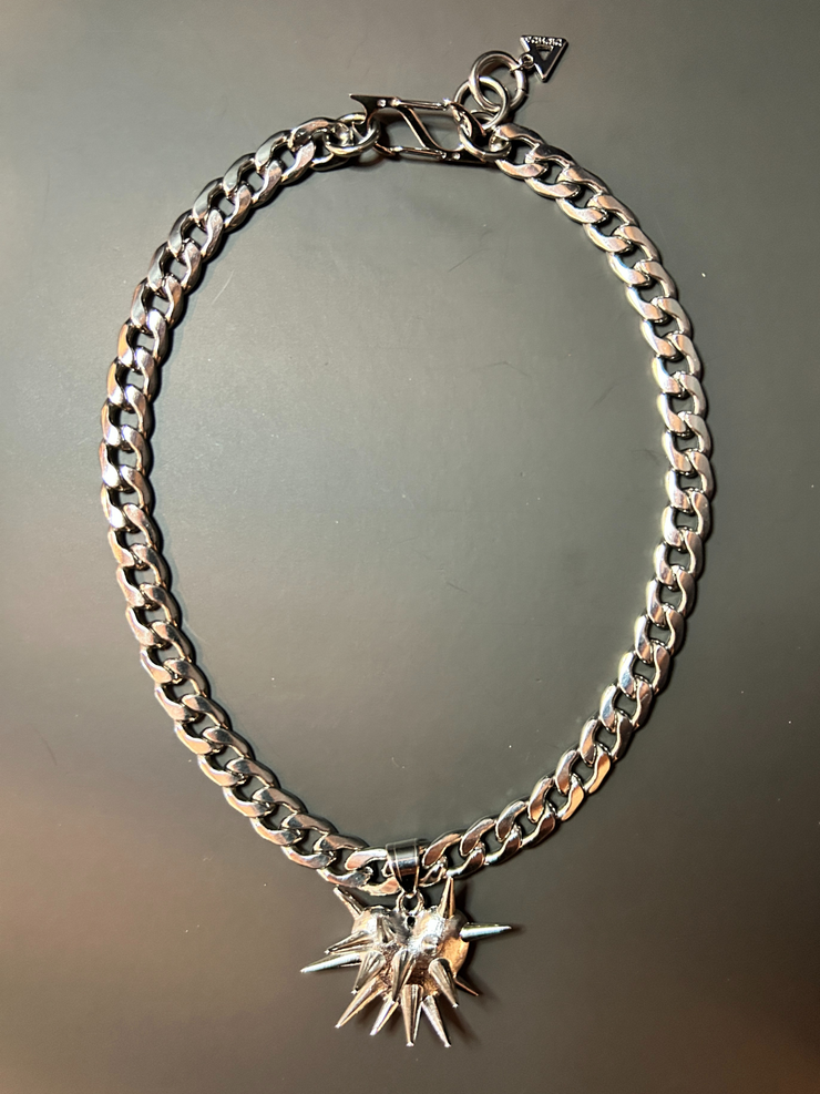 DIPHDA Slayed Heart Necklace with spike heart pendant on flat curb chain, available in gold or stainless steel—bold unisex statement jewelry handcrafted in LA.